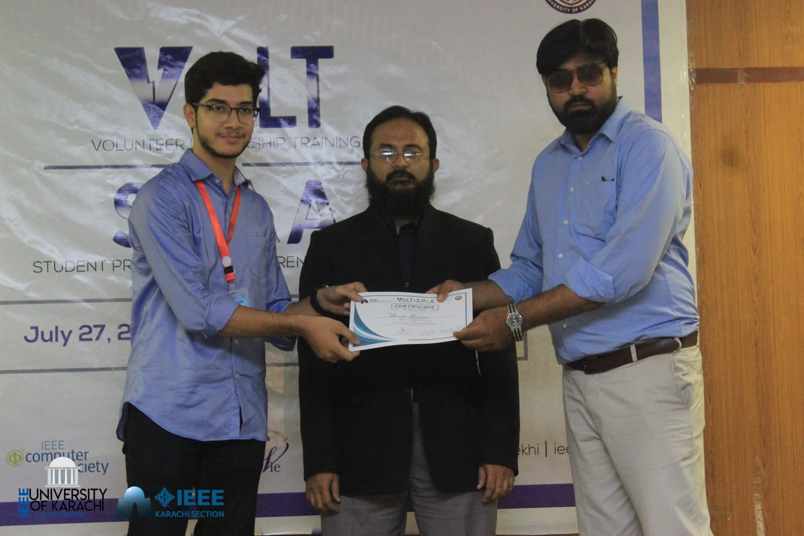 Raza Haider receiving the VOLT & SPAC certificate at IEEE Karachi Section